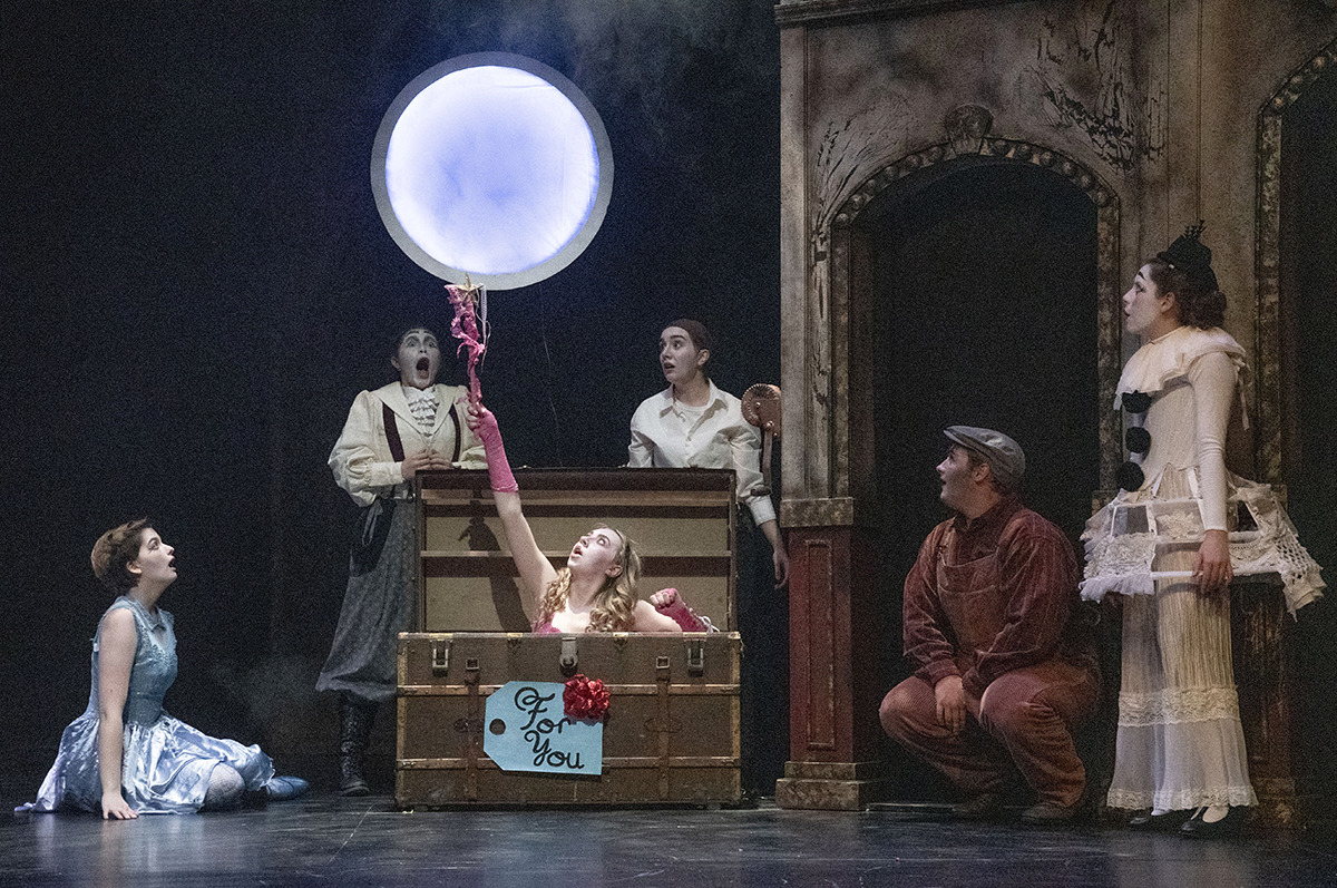 College students in costumes on stage